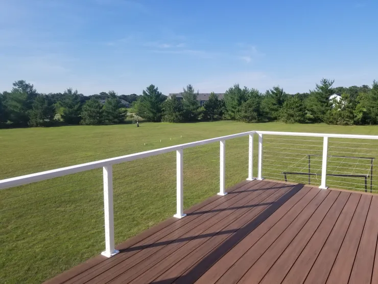 Big Lake 2020 TimberTech Mahogany deck with ADI cable rail - Foremost Construction